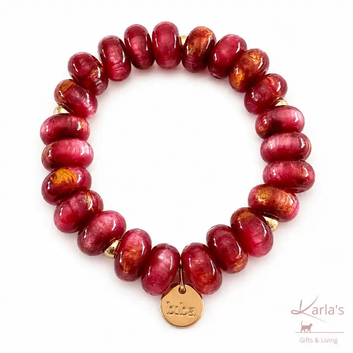 Biba armband met raspberryroze kralen en goudkleurige details - Karla's